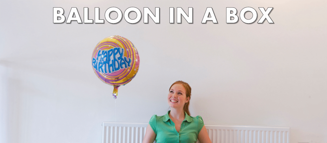 balloon in a box happy woman